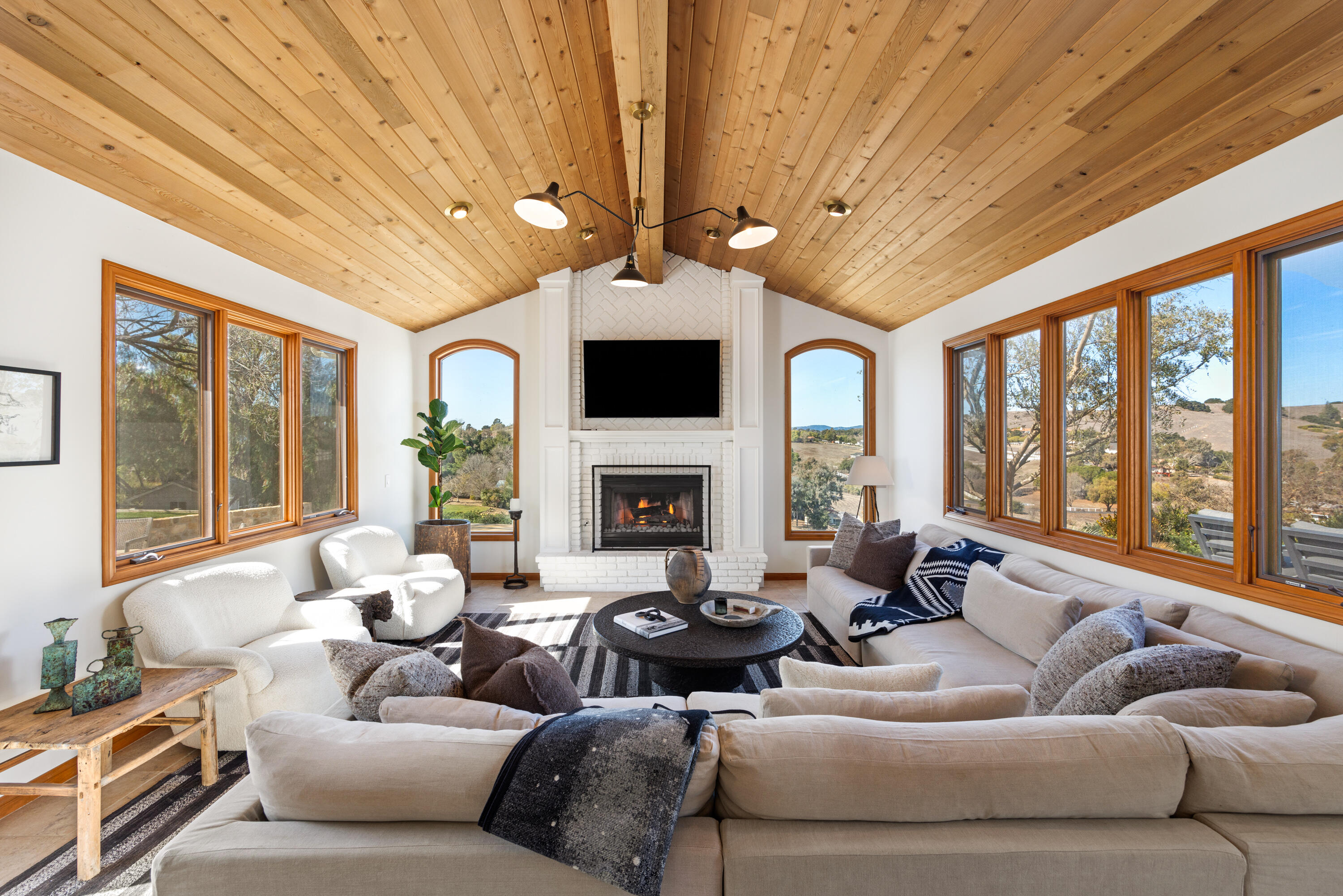 851 Adobe Creek Road Solvang, CA 93463 - Photo 12 of 46 a living room with furniture ceiling fan and a large window