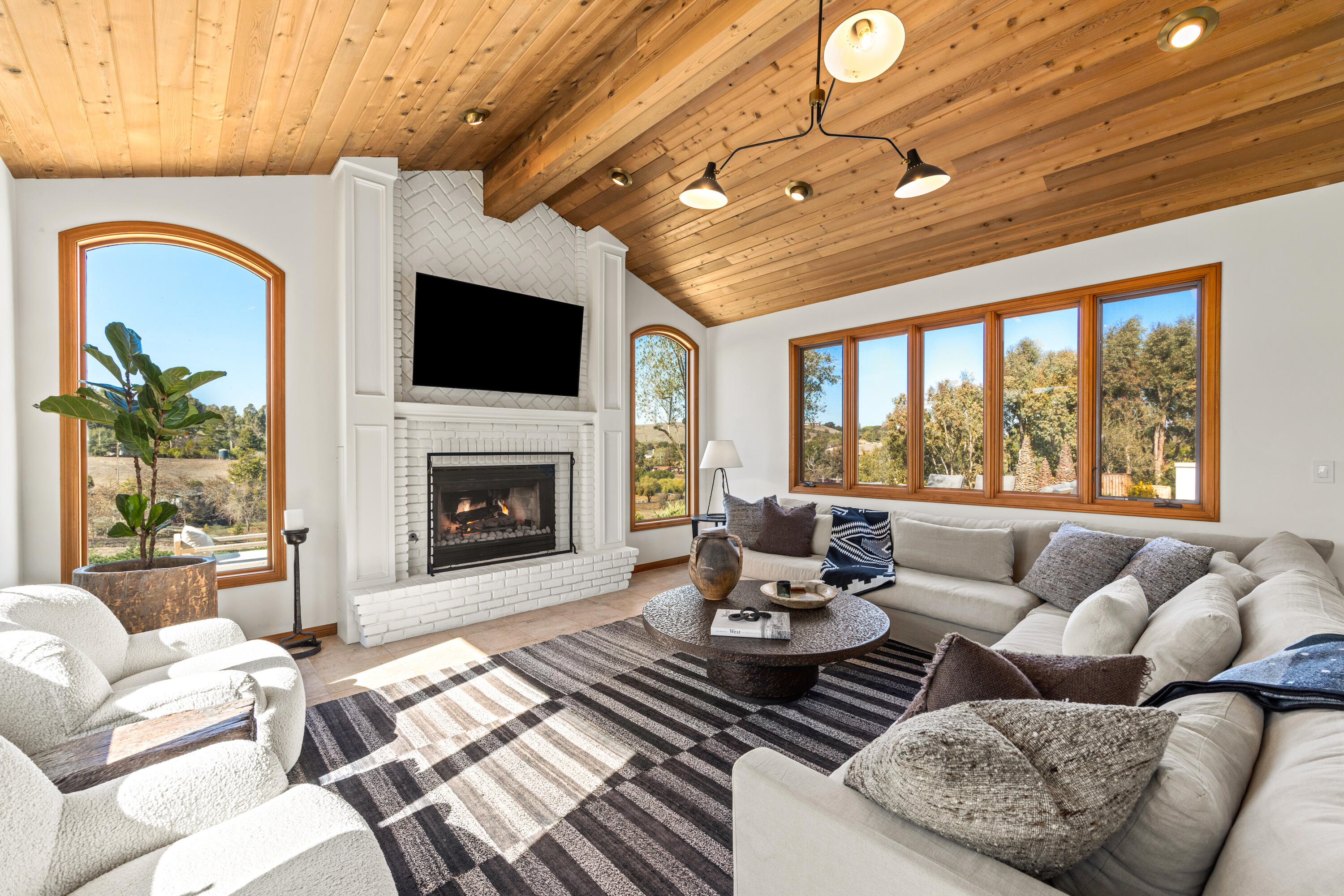 851 Adobe Creek Road Solvang, CA 93463 - Photo 13 of 46 a living room with furniture fireplace and flat screen tv