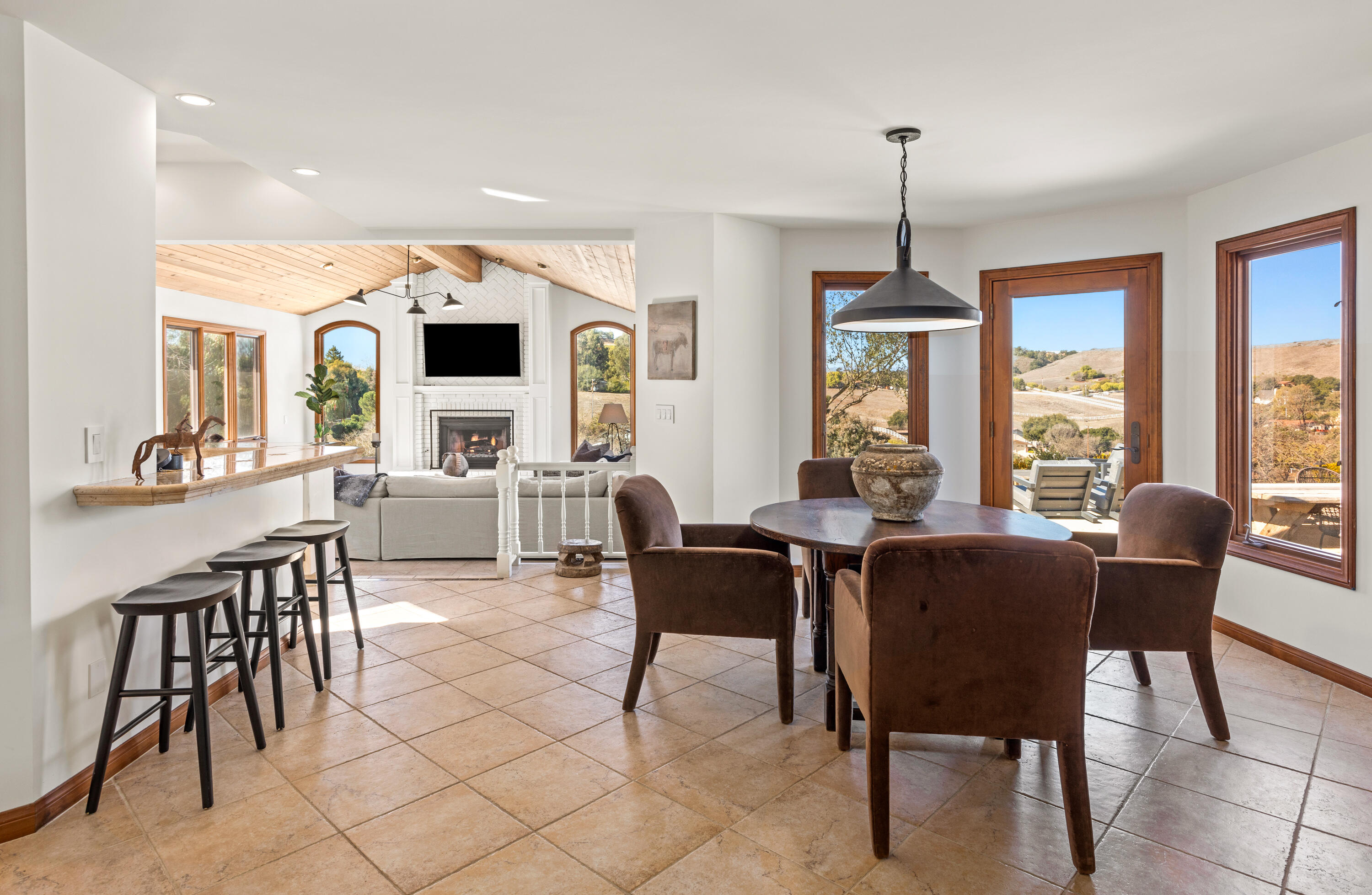 851 Adobe Creek Road Solvang, CA 93463 - Photo 15 of 46 a view of a dining room with furniture window and outside view