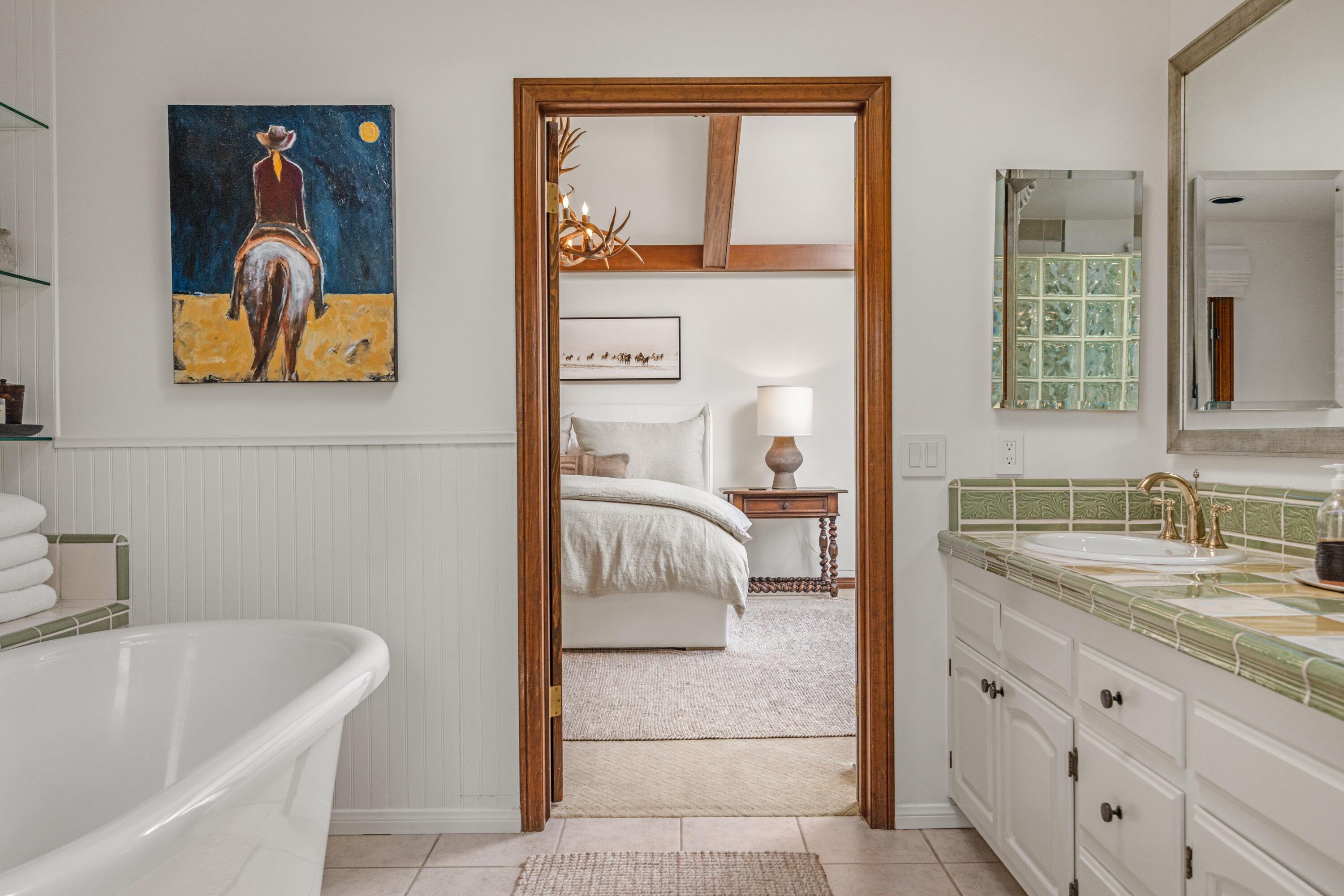 851 Adobe Creek Road Solvang, CA 93463 - Photo 17 of 46 a bathroom with a tub sink and mirror