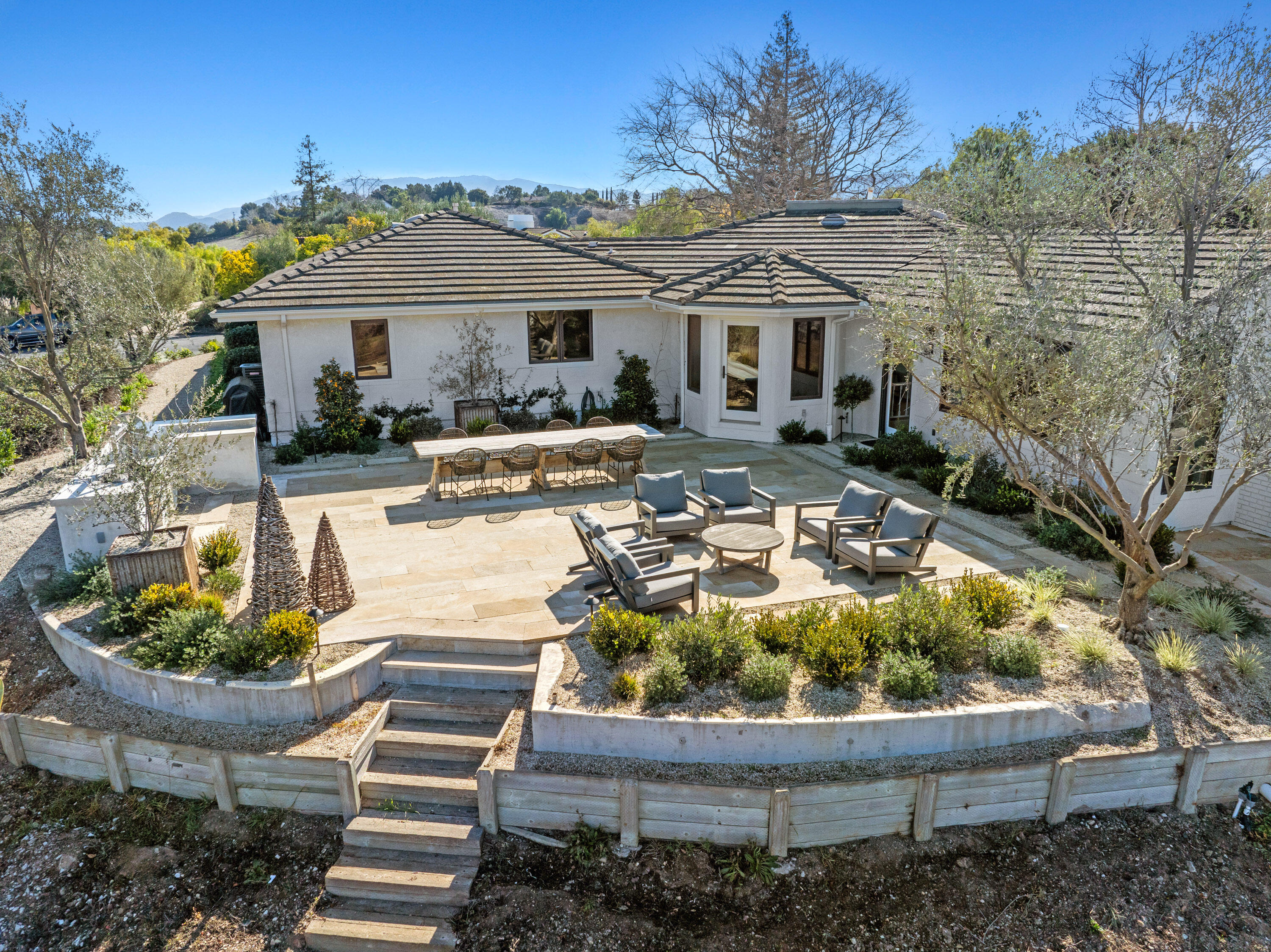 851 Adobe Creek Road Solvang, CA 93463 - Photo 40 of 46 a front view of a house with a yard patio and fire pit