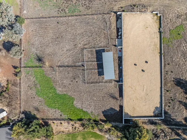 a aerial view of a house with a yard