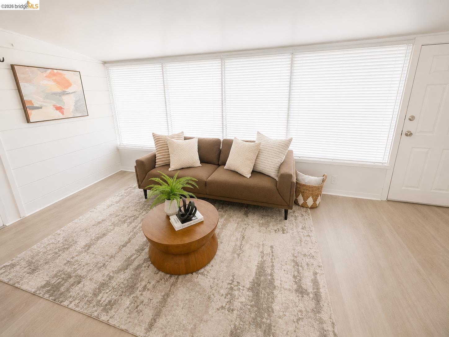 810 Pierce Street Albany, CA 94706 - Photo 17 of 25 Living space featuring light wood-finish flooring and a white shiplap accent wall