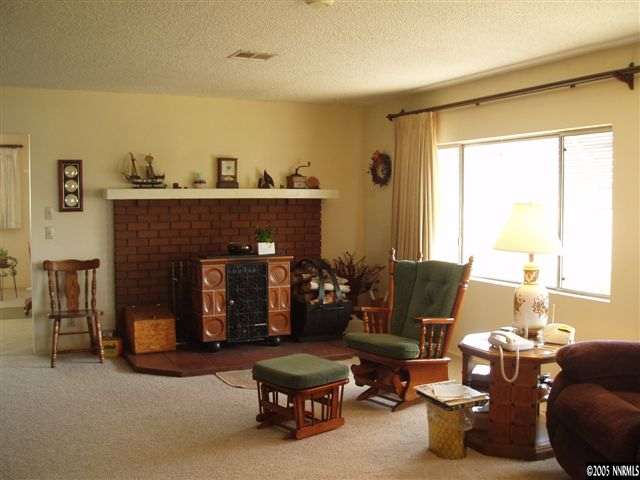 4768 Hiatt Loop Fallon, NV 89406 - Photo 3 of 9 a living room with furniture and a fireplace