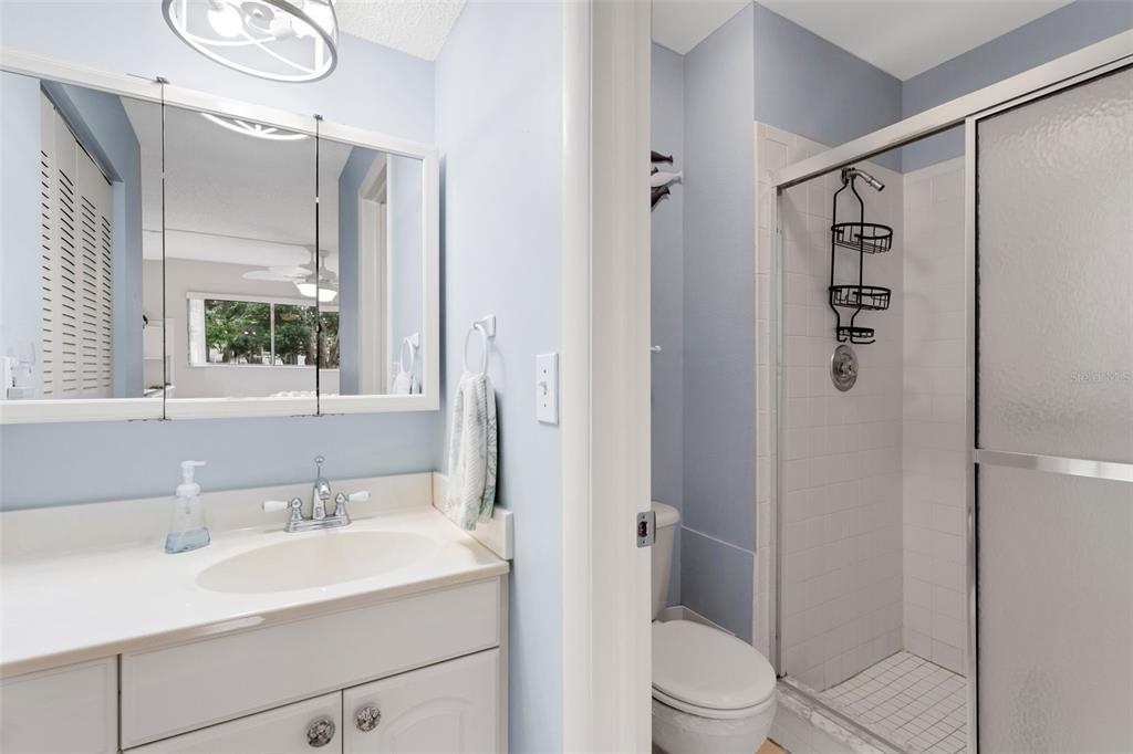 3140 Highlands Boulevard, Unit F Palm Harbor, FL 34684 - Photo 19 of 78 a bathroom with a sink toilet and shower