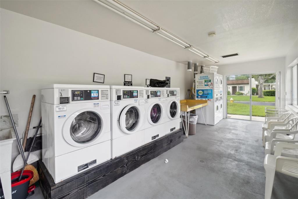 3140 Highlands Boulevard, Unit F Palm Harbor, FL 34684 - Photo 48 of 78 a utility room with dryer and washer