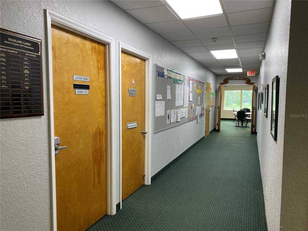 3140 Highlands Boulevard, Unit F Palm Harbor, FL 34684 - Photo 67 of 78 a view of a hallway with windows
