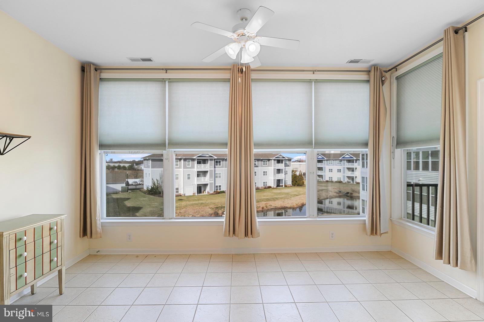 17432 Slipper Shell Way, Unit 18 Lewes, DE 19958 - Photo 5 of 32 Sunroom
