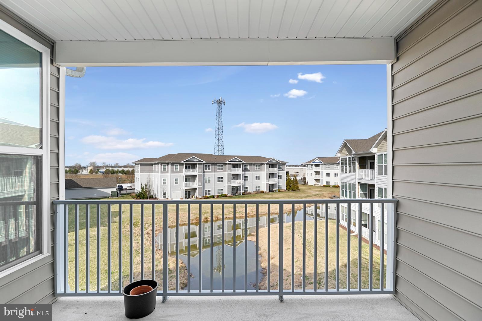 17432 Slipper Shell Way, Unit 18 Lewes, DE 19958 - Photo 8 of 32 Balcony View of Pond