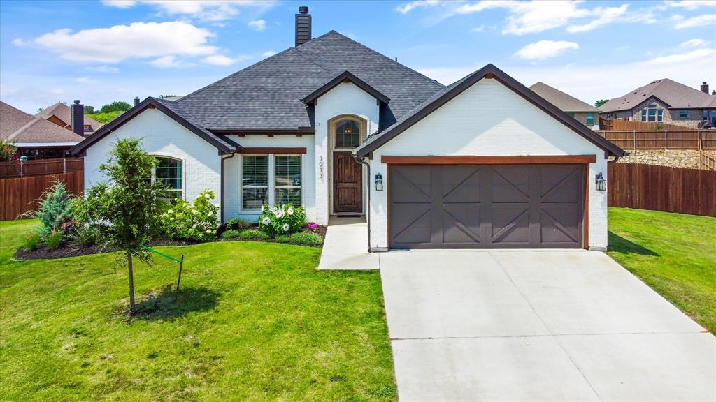 3033 Ridgemont Court Weatherford, TX 76086 - Photo 1 of 1 a front view of a house with a yard and garage