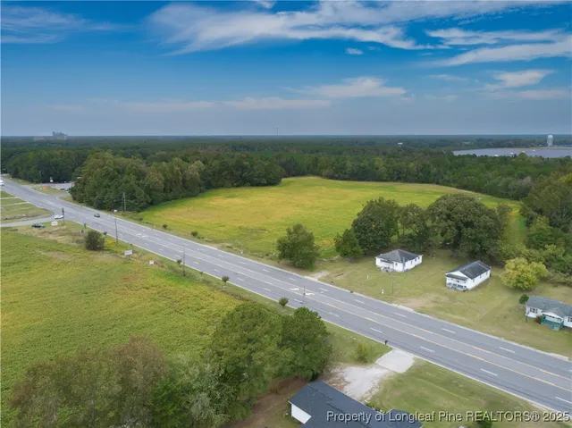 a view of a yard with an outdoor seating