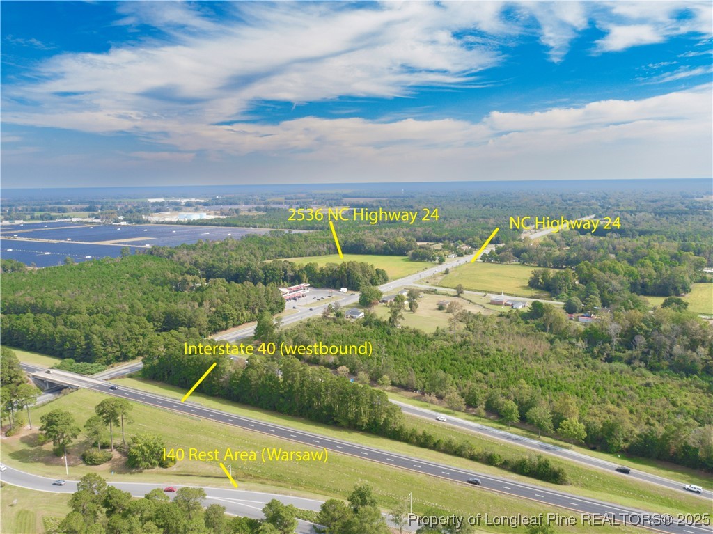 2536 Highway 24 Warsaw, NC 28398 - Photo 4 of 9 a view of a yard with an outdoor seating