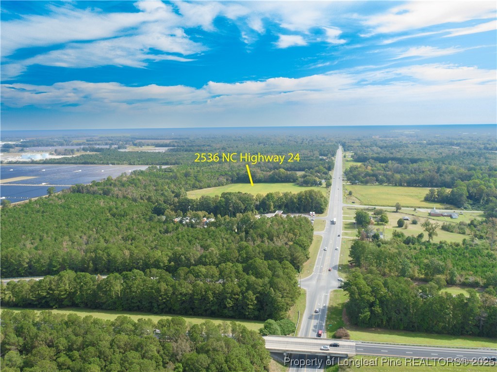 2536 Highway 24 Warsaw, NC 28398 - Photo 5 of 9 a view of a yard with an outdoor seating