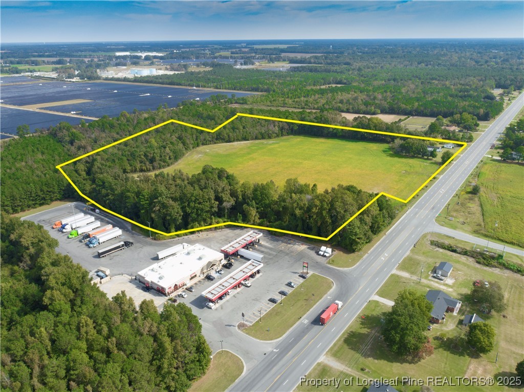 2536 Highway 24 Warsaw, NC 28398 - Photo 6 of 9 a view of a swimming pool with an outdoor seating