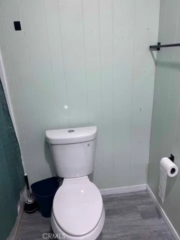 a white toilet sitting next to a sink