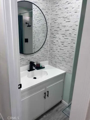 a bathroom with a sink and a mirror