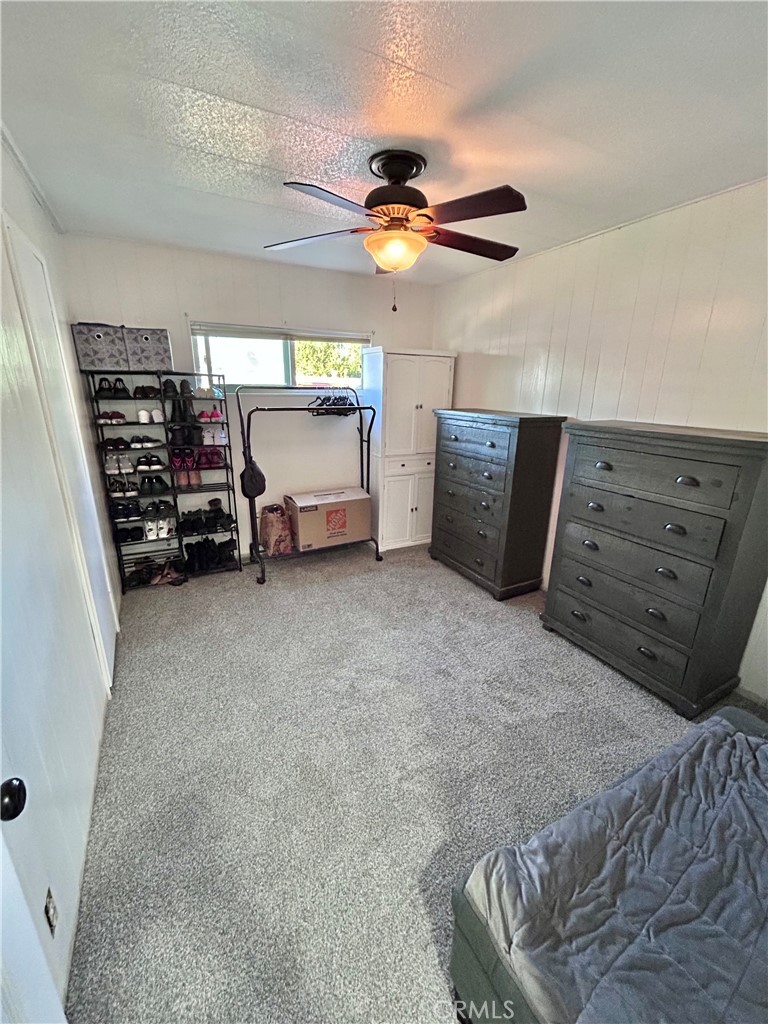 2751 Reche Canyon Road Moreno Valley, CA 92555 - Photo 20 of 20 a bedroom with a bed and a walk in closet