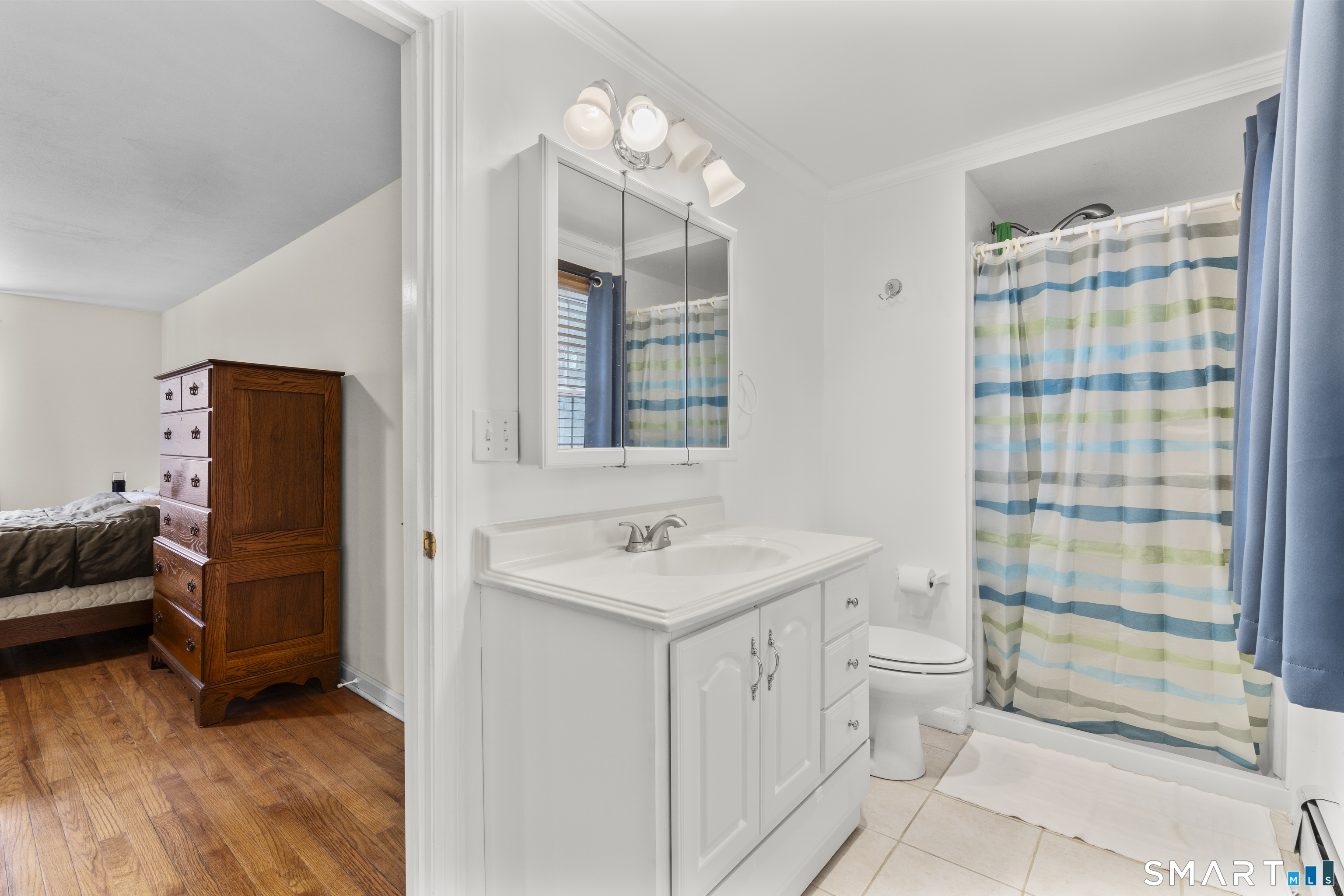 20 Inchcliffe Drive Ledyard, CT 06335 - Photo 16 of 40 a bathroom with a sink toilet and shower