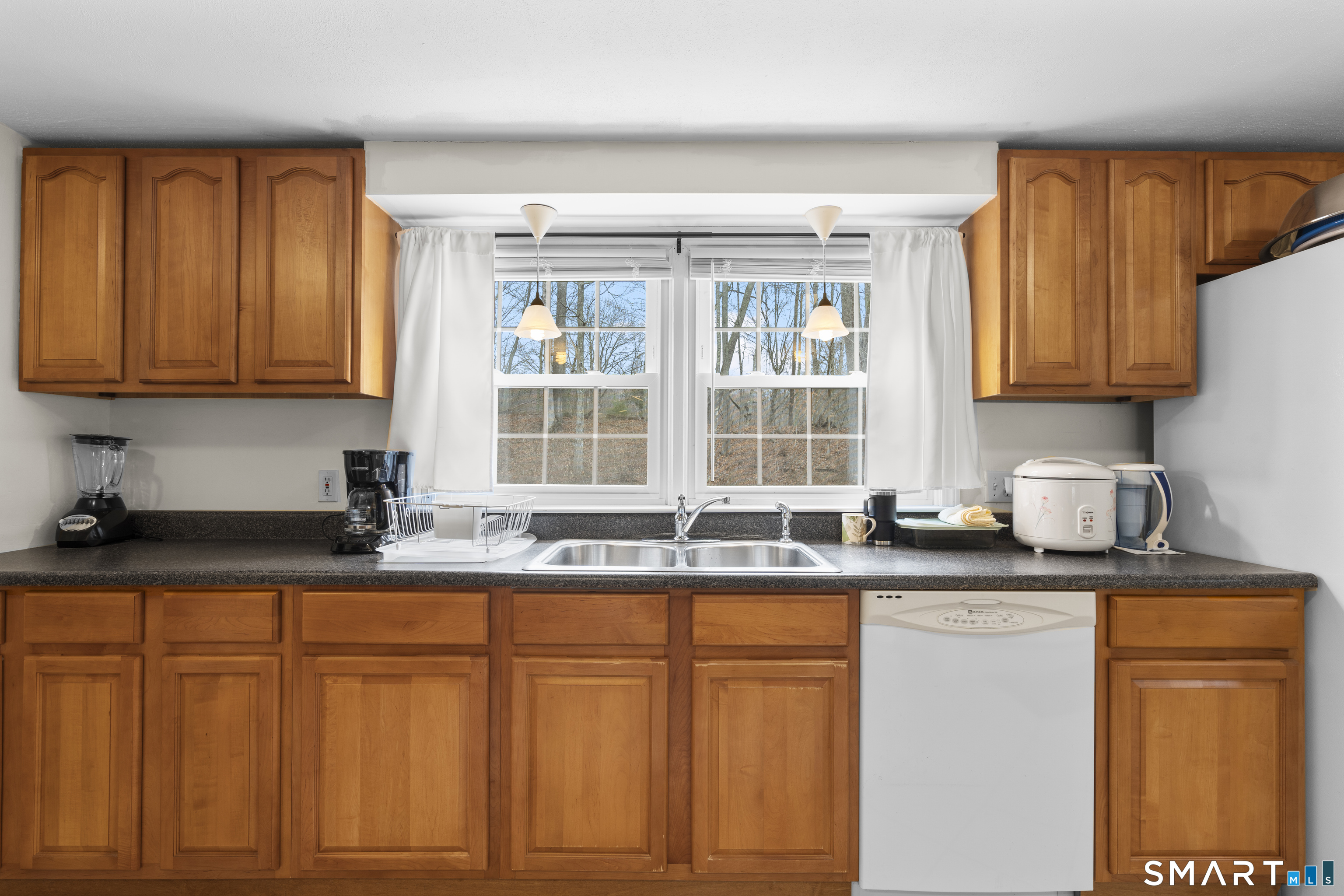 20 Inchcliffe Drive Ledyard, CT 06335 - Photo 7 of 40 a kitchen with granite countertop cabinets and window