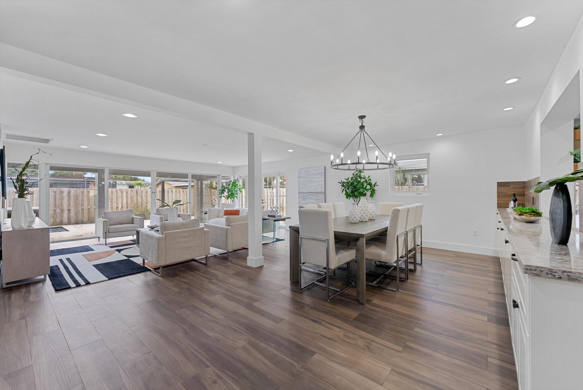 5412 Arthur Street Hollywood, FL 33021 - Photo 20 of 67 a living room with furniture dining table and a flat screen tv