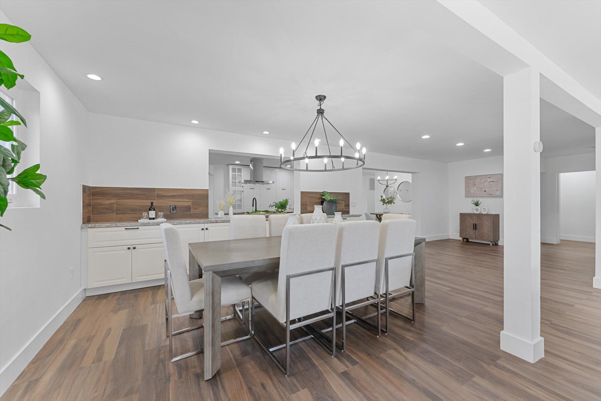 5412 Arthur Street Hollywood, FL 33021 - Photo 22 of 67 a living room with furniture and a chandelier