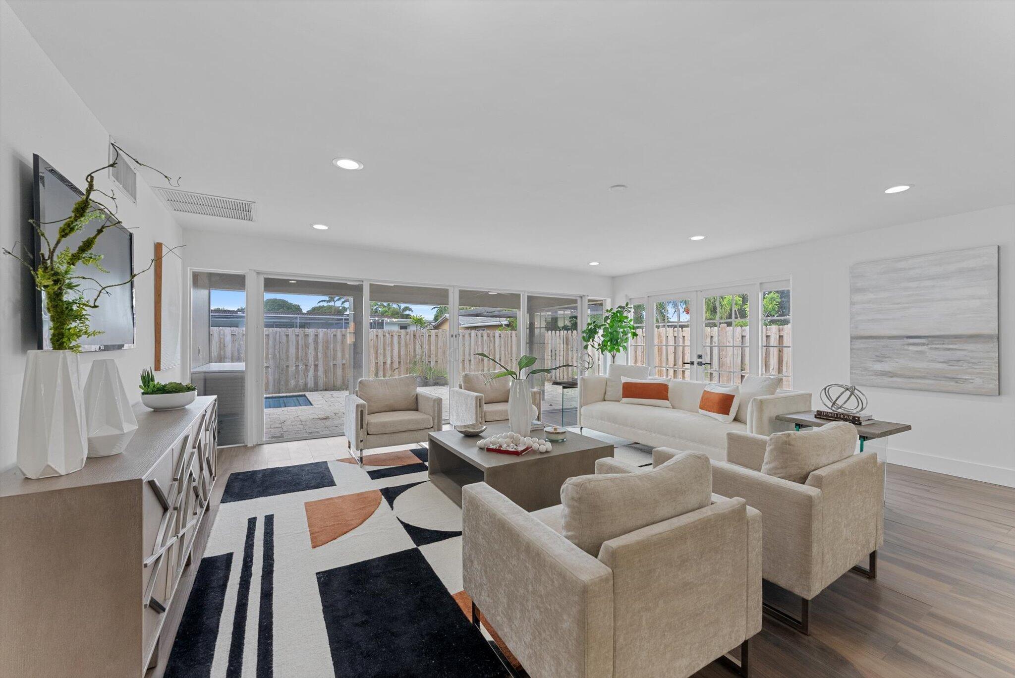 5412 Arthur Street Hollywood, FL 33021 - Photo 28 of 67 a living room with furniture fireplace and a table