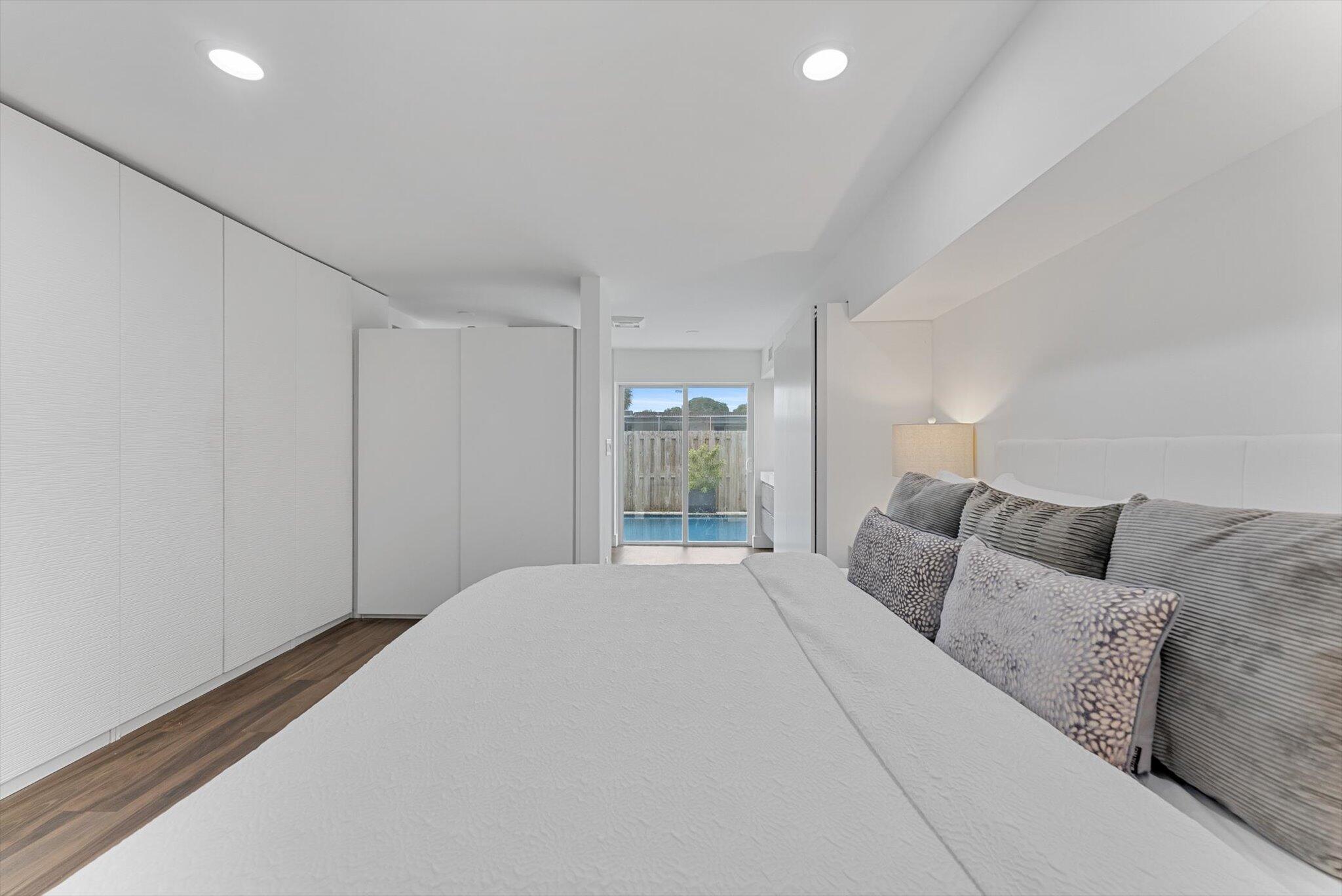 5412 Arthur Street Hollywood, FL 33021 - Photo 40 of 67 a bedroom with a large bed and a window