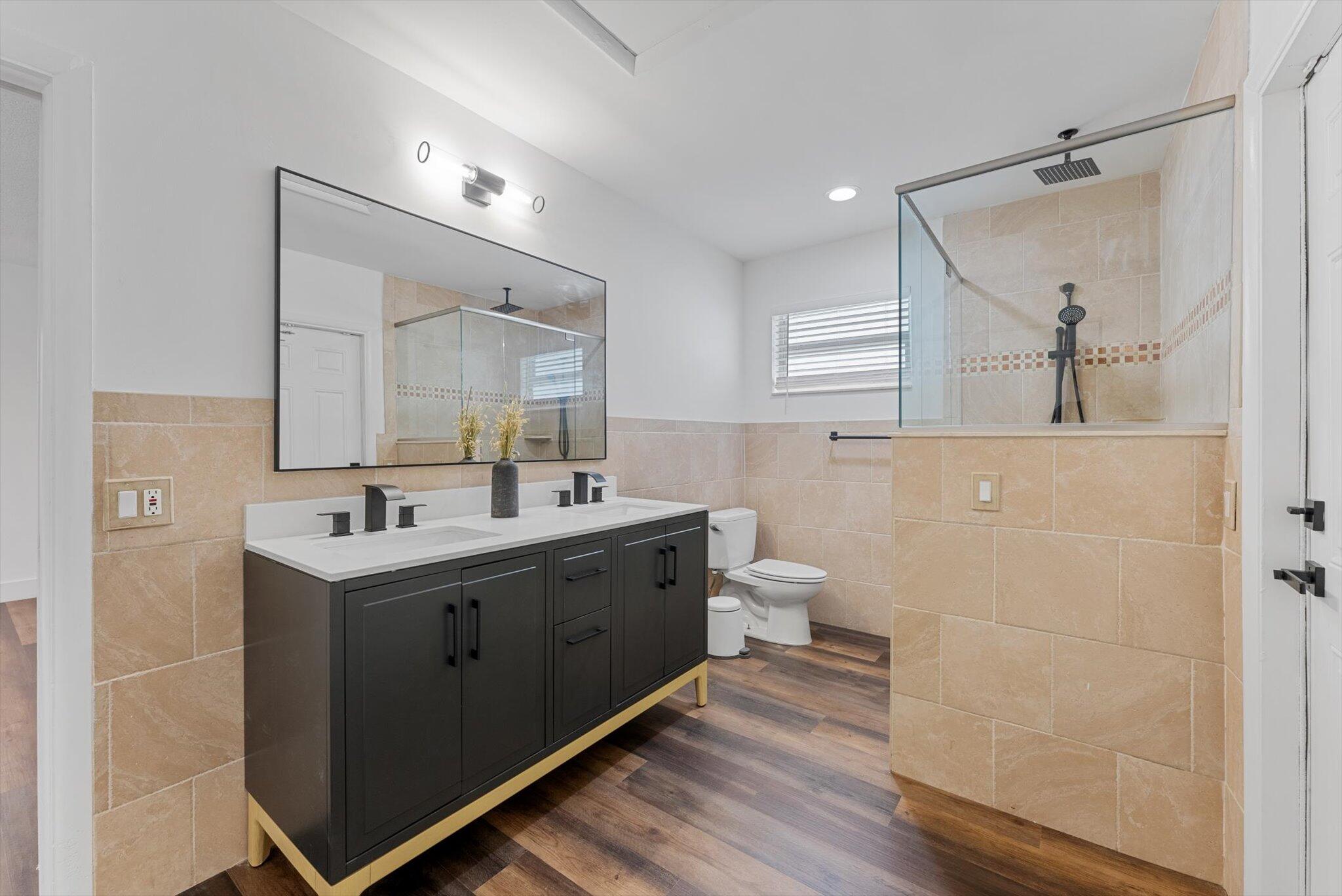 5412 Arthur Street Hollywood, FL 33021 - Photo 47 of 67 a bathroom with a sink mirror and a toilet