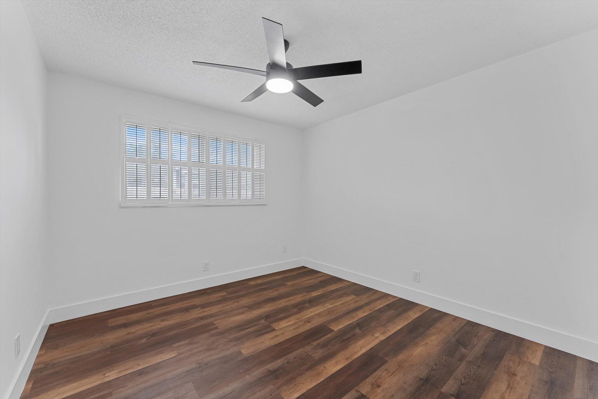 5412 Arthur Street Hollywood, FL 33021 - Photo 52 of 67 wooden floor in an empty room with a window