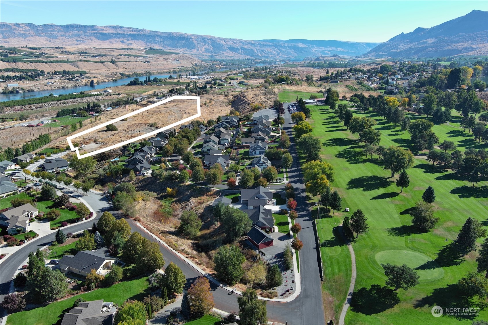 an aerial view of residential houses and outdoor space