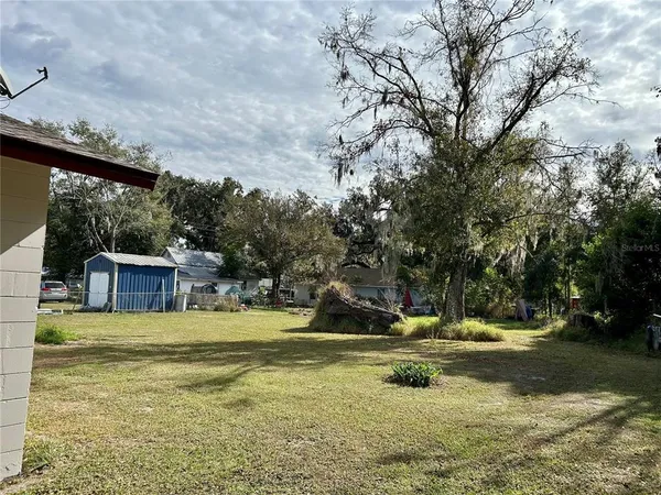 a view of a playground with a yard