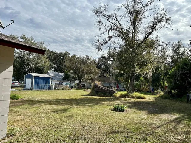 a view of a playground with a yard