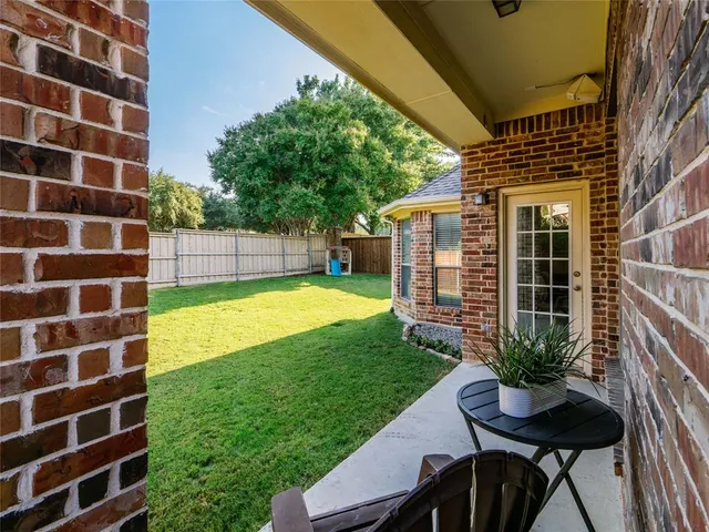 a view of a house with a yard porch and sitting area