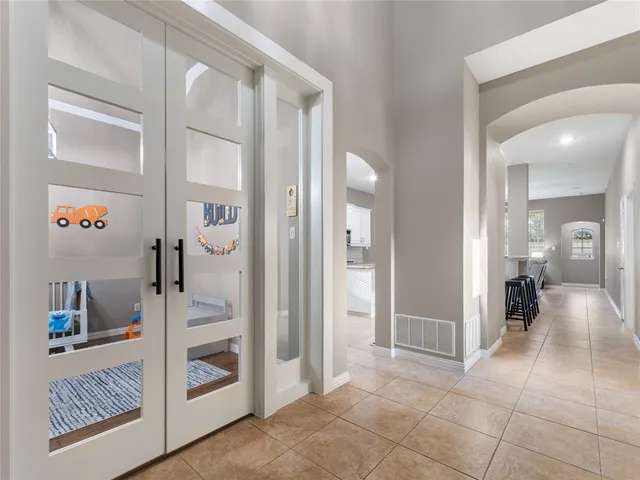 a view of a hallway with bathroom