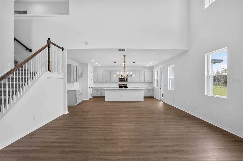 5788 Haystack Drive St. Cloud, FL 34771 - Photo 11 of 31 a view of kitchen with furniture and wooden floor