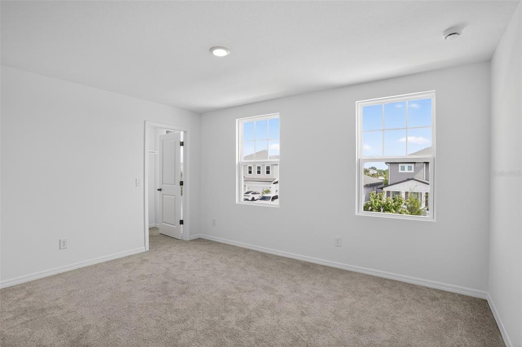 5788 Haystack Drive St. Cloud, FL 34771 - Photo 20 of 31 an empty room with windows
