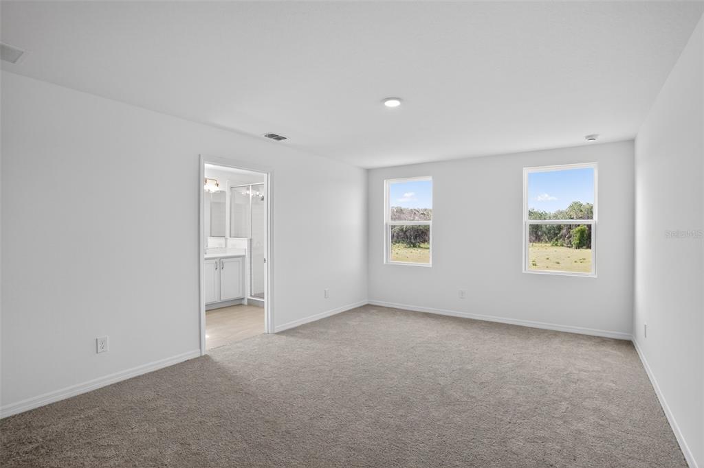 5788 Haystack Drive St. Cloud, FL 34771 - Photo 23 of 31 an empty room with windows and closet