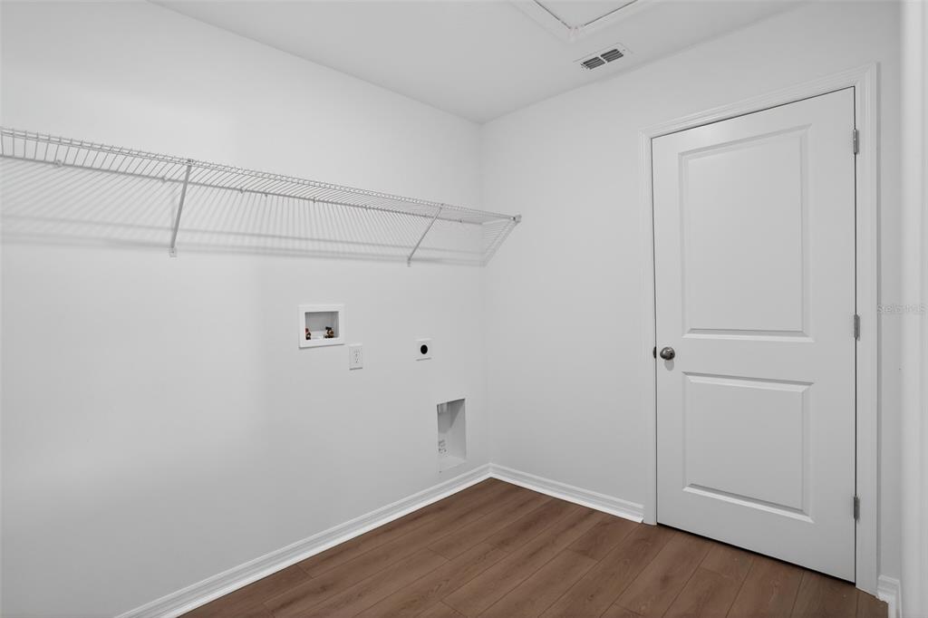 5788 Haystack Drive St. Cloud, FL 34771 - Photo 26 of 31 a view of a room with wooden floor