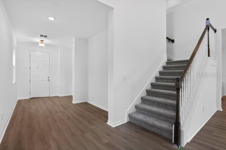 5788 Haystack Drive St. Cloud, FL 34771 - Photo 3 of 31 a view of entryway with wooden floor