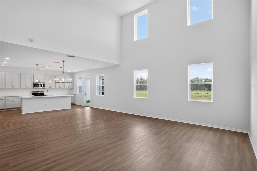 5788 Haystack Drive St. Cloud, FL 34771 - Photo 7 of 31 a view of a kitchen with wooden floor and a window