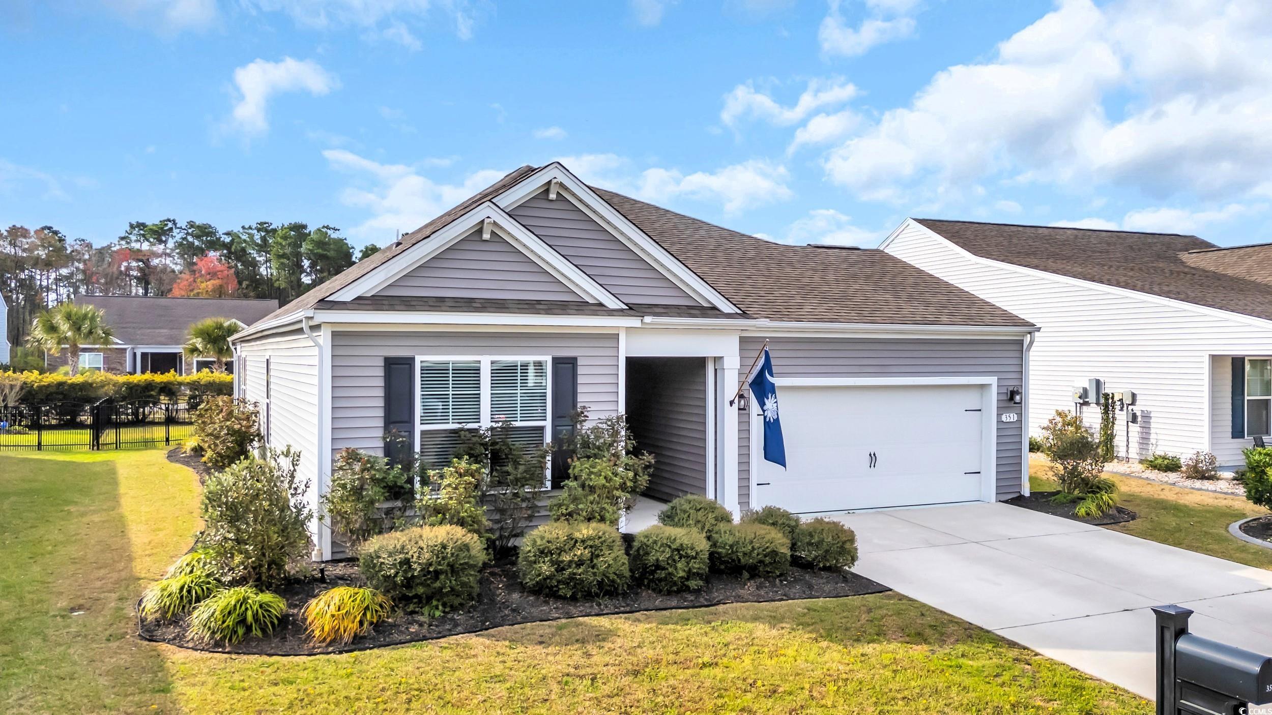 351 Firenze Loop Myrtle Beach, SC 29579 - Photo 1 of 37 View of front of home with a front yard, concrete