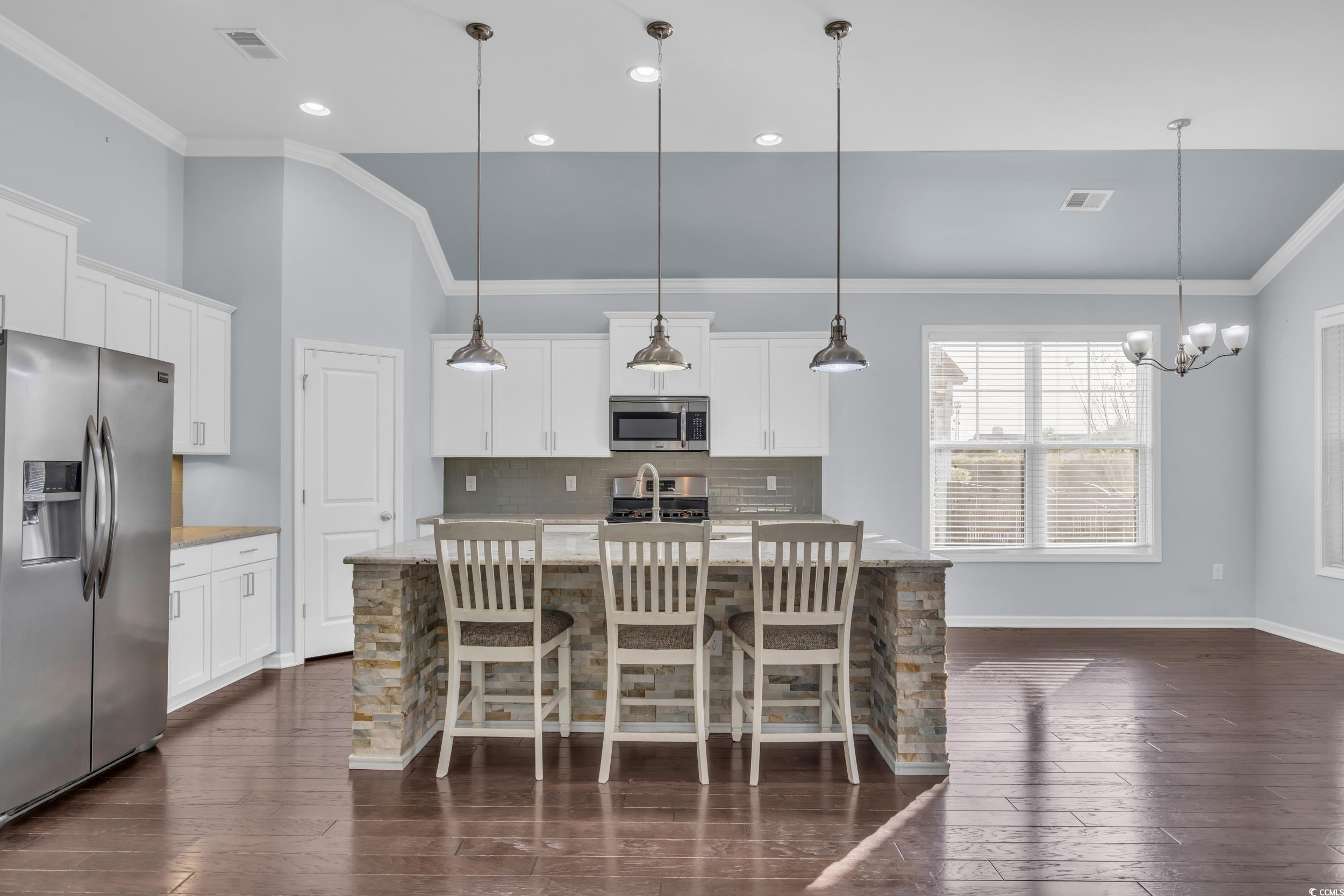 351 Firenze Loop Myrtle Beach, SC 29579 - Photo 12 of 37 Kitchen with decorative backsplash, visible vents,
