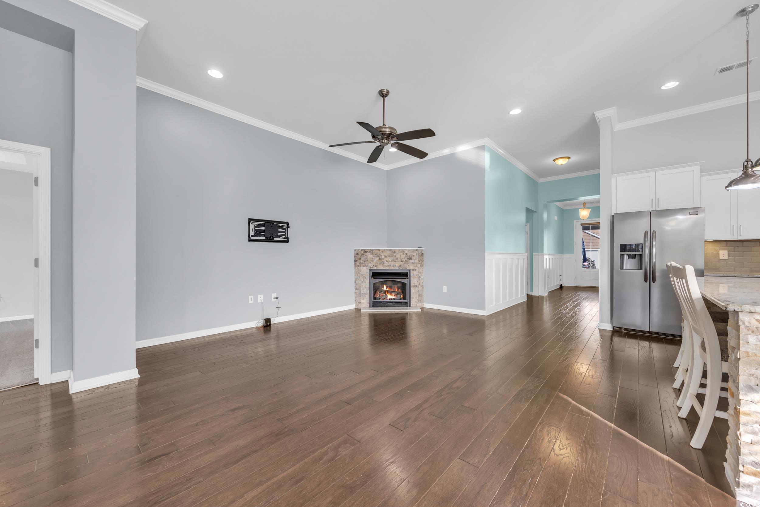 351 Firenze Loop Myrtle Beach, SC 29579 - Photo 13 of 37 Unfurnished living room with crown molding, ceilin