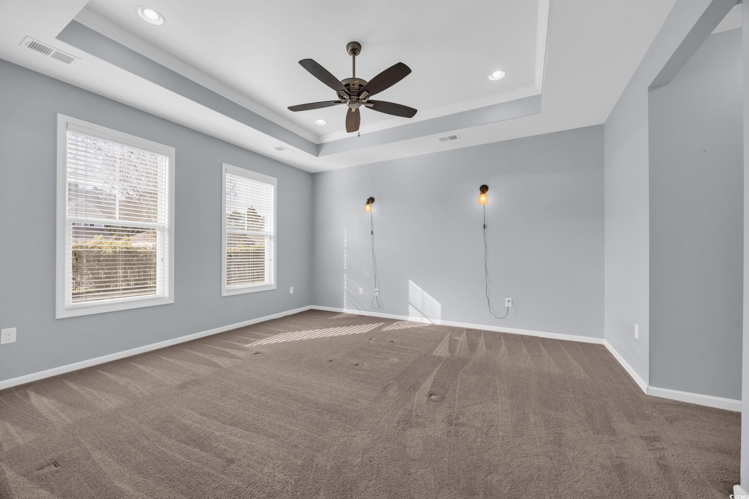 351 Firenze Loop Myrtle Beach, SC 29579 - Photo 15 of 37 Carpeted spare room with baseboards, a tray ceilin