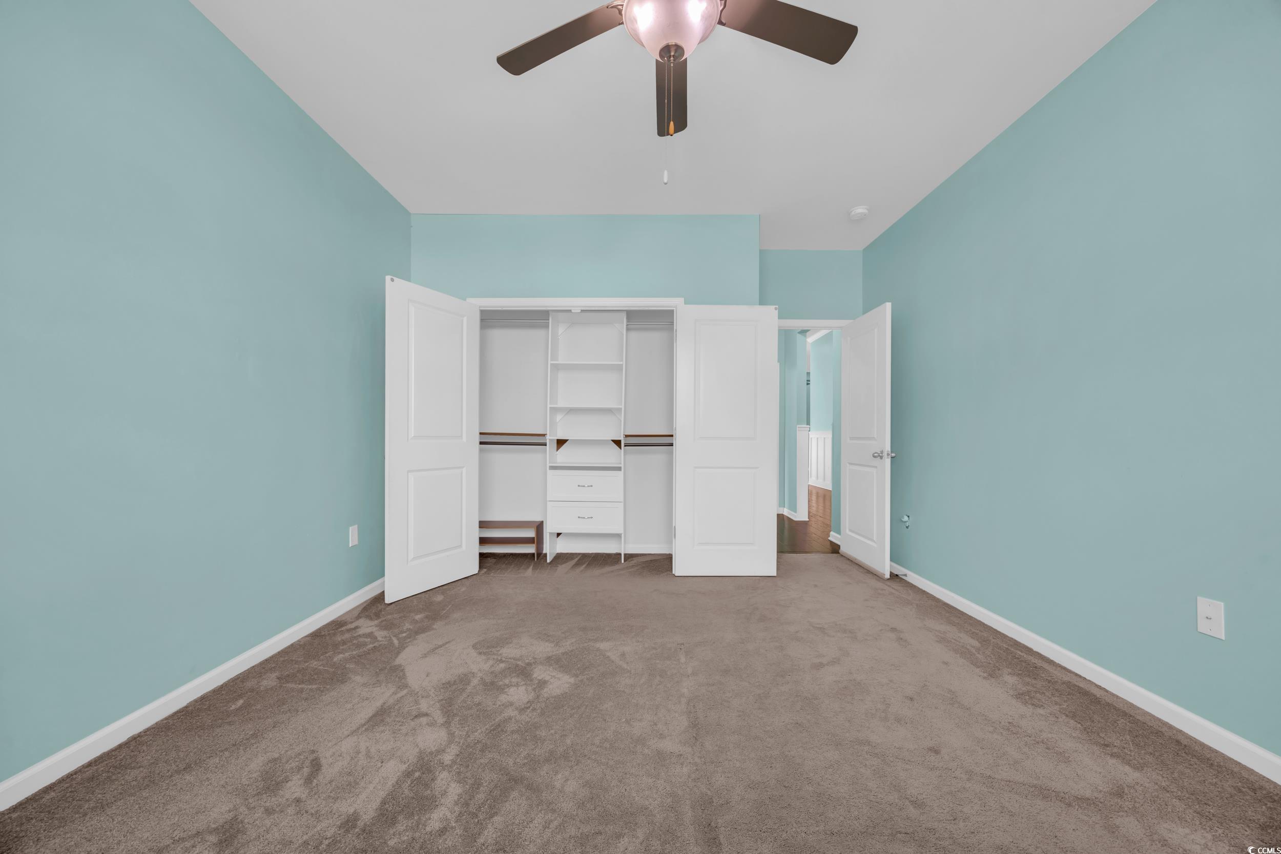 351 Firenze Loop Myrtle Beach, SC 29579 - Photo 20 of 37 Unfurnished bedroom featuring a ceiling fan, carpe