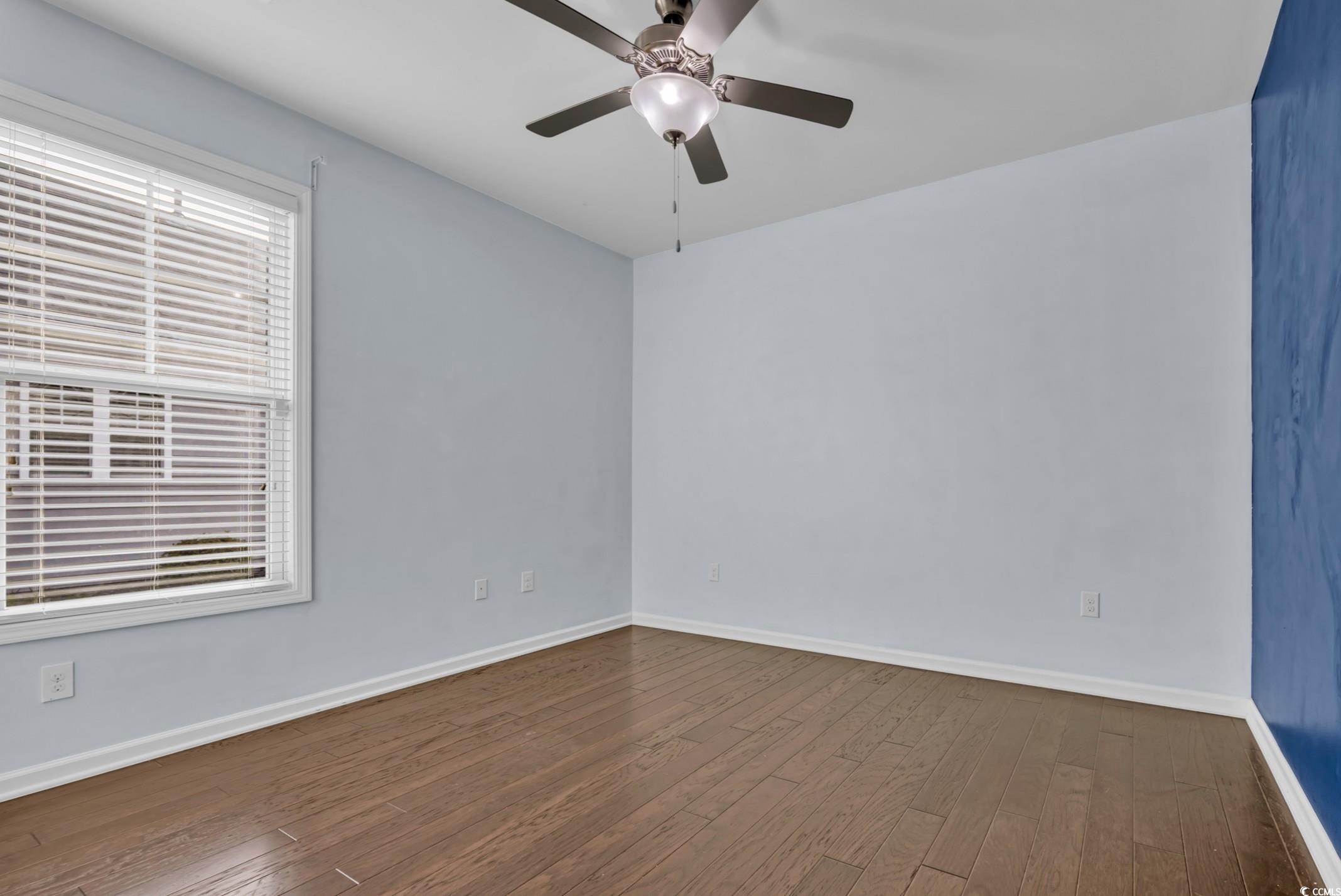351 Firenze Loop Myrtle Beach, SC 29579 - Photo 22 of 37 Empty room featuring dark wood-style floors, baseb