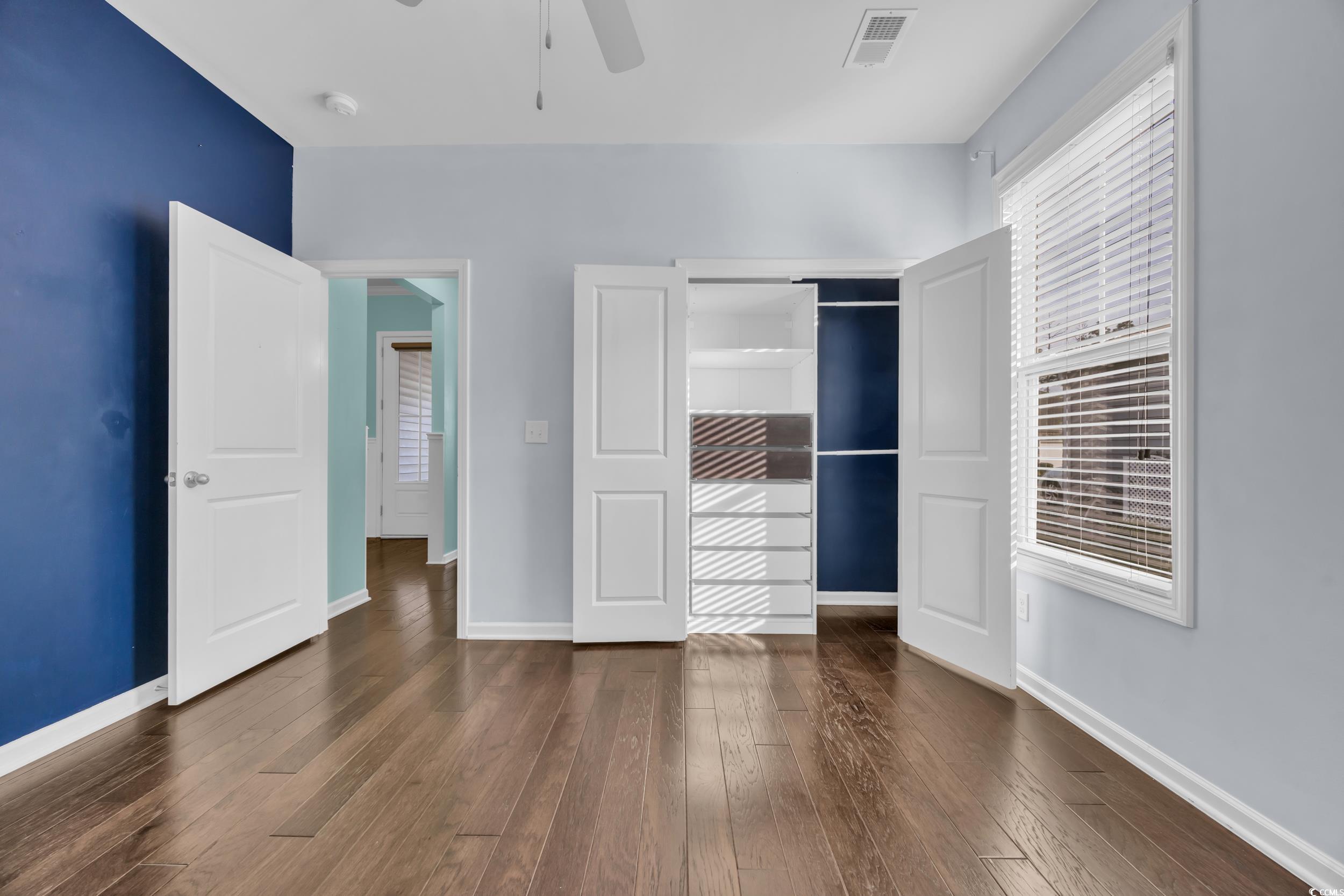 351 Firenze Loop Myrtle Beach, SC 29579 - Photo 23 of 37 Unfurnished bedroom with wood-type flooring, baseb