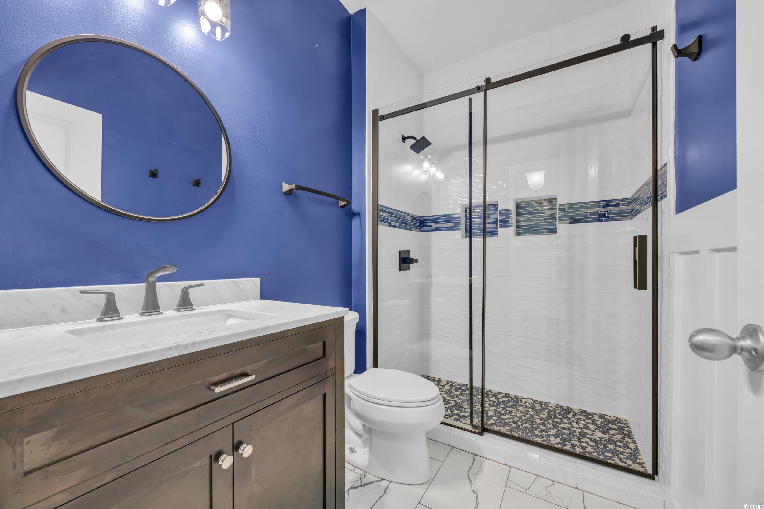 351 Firenze Loop Myrtle Beach, SC 29579 - Photo 24 of 37 Full bathroom featuring marble finish floor, vanit