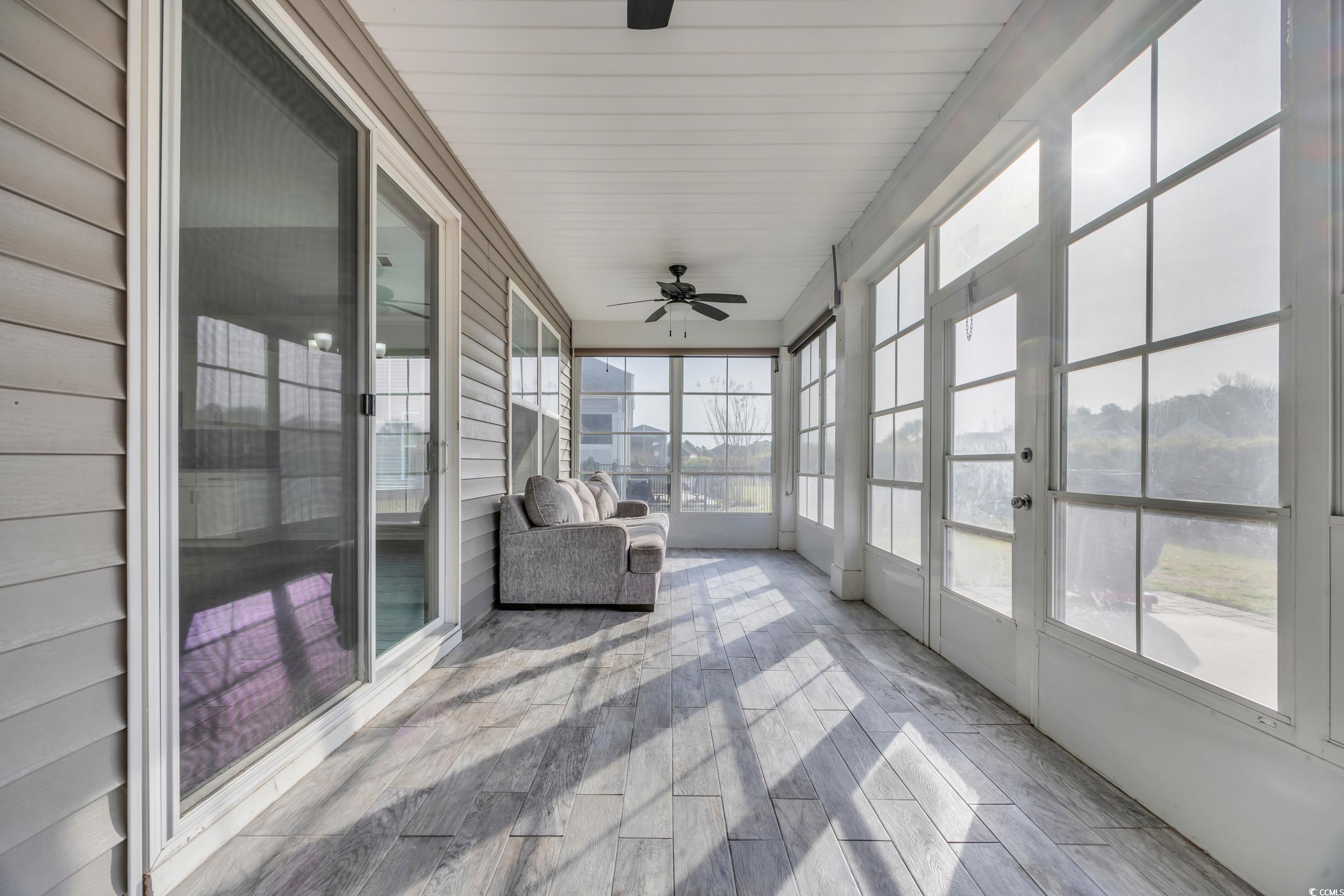 351 Firenze Loop Myrtle Beach, SC 29579 - Photo 27 of 37 Unfurnished sunroom with a ceiling fan and wood fi