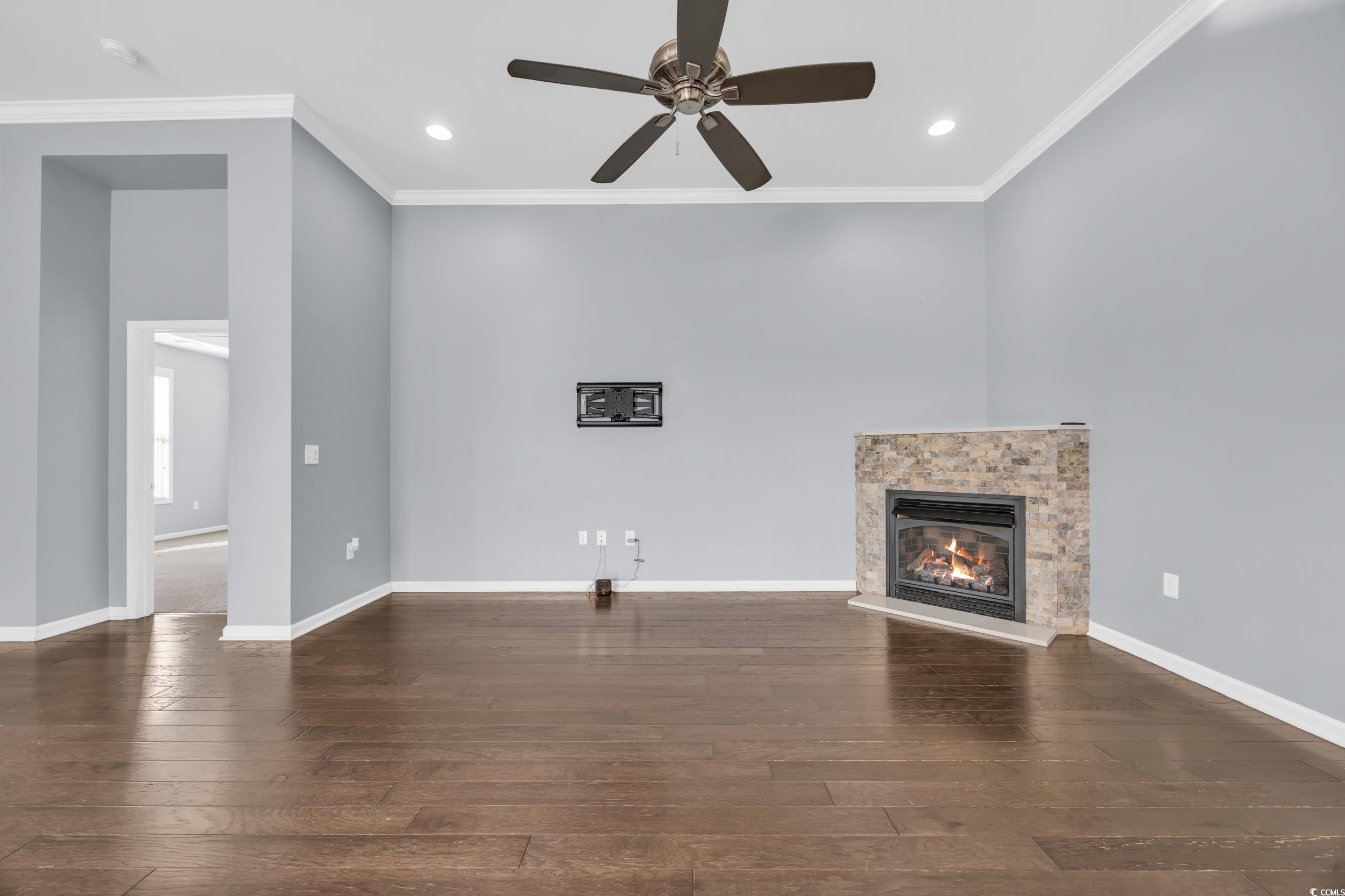 351 Firenze Loop Myrtle Beach, SC 29579 - Photo 6 of 37 Unfurnished living room featuring crown molding, a